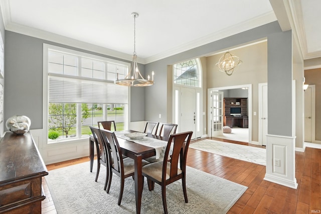 101 Twin Eagles Blvd W, Huntertown, IN 46748 - dining room featuring a chandelier, crown molding, wood-type flooring, and a high ceiling