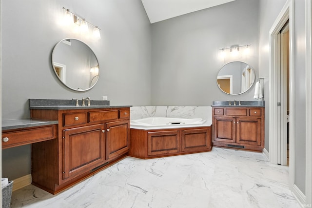 101 Twin Eagles Blvd W, Huntertown, IN 46748 - bathroom with marble finish flooring, two vanities, a bath, vaulted ceiling, and baseboards