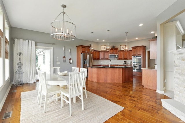 101 Twin Eagles Blvd W, Huntertown, IN 46748 - dining room featuring a chandelier, light wood finished floors, and recessed lighting