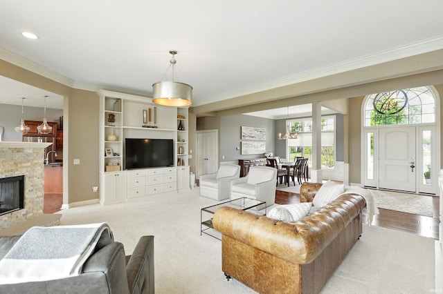 101 Twin Eagles Blvd W, Huntertown, IN 46748 - living area featuring ornamental molding, baseboards, and a stone fireplace