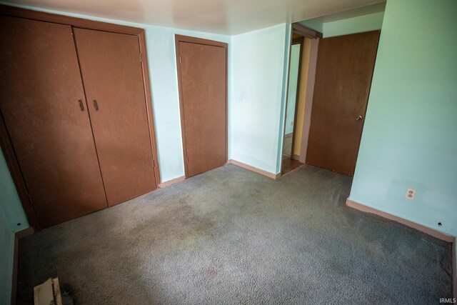 8147 15th Rd, Argos, IN 46501 - unfurnished bedroom with carpet floors and multiple closets