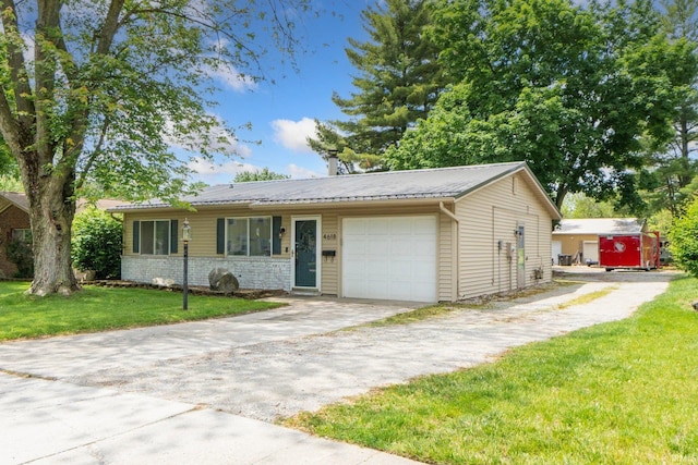 4618 Kekionga Dr, Fort Wayne, IN 46809 - ranch-style house with an attached garage, a front yard, concrete driveway, metal roof, and stone siding