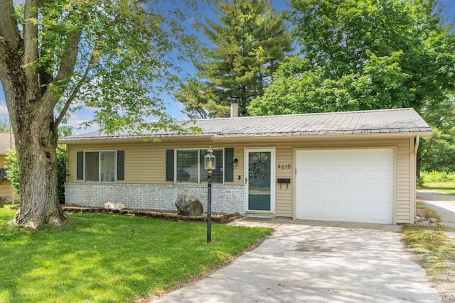 4618 Kekionga Dr, Fort Wayne, IN 46809 - view of front of house featuring a garage, a front lawn, driveway, and metal roof