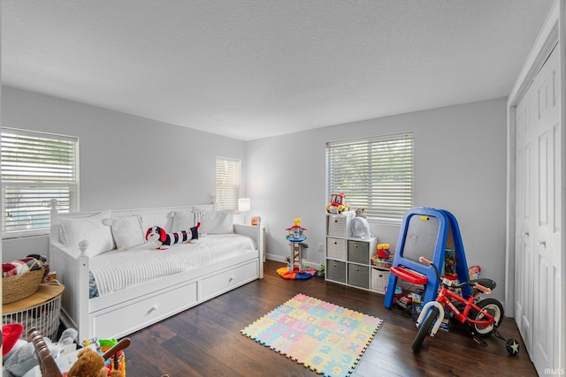 4618 Kekionga Dr, Fort Wayne, IN 46809 - bedroom with multiple windows, wood finished floors, and a closet