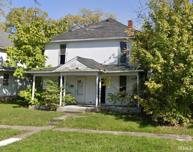 143 S Broad St, Dunkirk, IN 47336 - view of front of property featuring covered porch, a chimney, a front yard, and a shingled roof