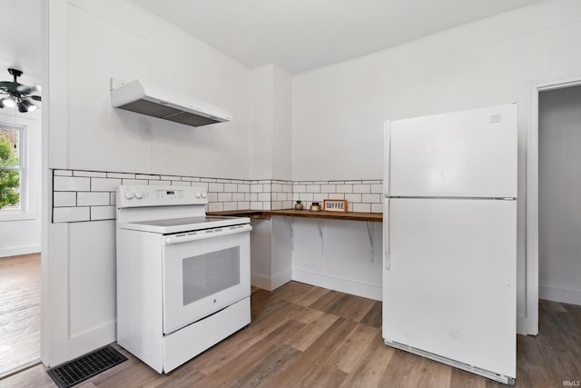 44 E Taylor St, Huntington, IN 46750 - kitchen with white appliances, under cabinet range hood, wood finished floors, decorative backsplash, and a ceiling fan