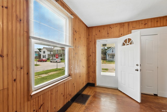 44 E Taylor St, Huntington, IN 46750 - entrance foyer with plenty of natural light, wood finished floors, wood walls, and baseboards