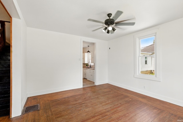 44 E Taylor St, Huntington, IN 46750 - empty room with a sink, a ceiling fan, hardwood / wood-style flooring, and baseboards