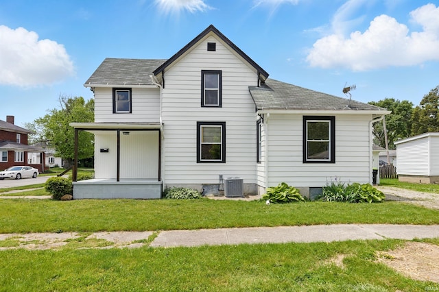 44 E Taylor St, Huntington, IN 46750 - view of front of home featuring central AC, a front lawn, a porch, and roof with shingles