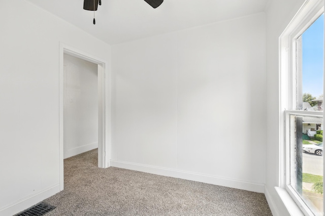 44 E Taylor St, Huntington, IN 46750 - carpeted spare room featuring ceiling fan, plenty of natural light, and baseboards