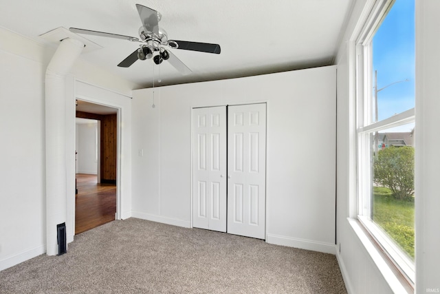 44 E Taylor St, Huntington, IN 46750 - unfurnished bedroom with carpet, a closet, a ceiling fan, and baseboards