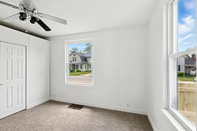 44 E Taylor St, Huntington, IN 46750 - unfurnished bedroom with carpet flooring, baseboards, ceiling fan, and a closet