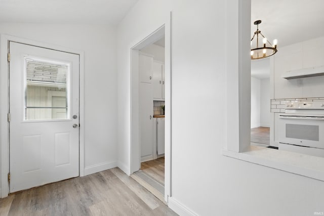 44 E Taylor St, Huntington, IN 46750 - entryway featuring light wood finished floors, a chandelier, and baseboards