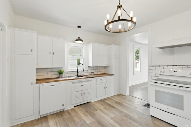 44 E Taylor St, Huntington, IN 46750 - kitchen with white appliances, a sink, tasteful backsplash, wood counters, and a chandelier