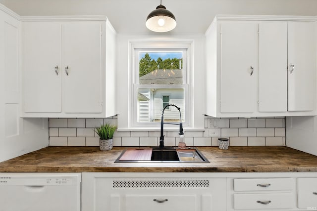 44 E Taylor St, Huntington, IN 46750 - kitchen with dishwasher, dark countertops, a sink, and backsplash