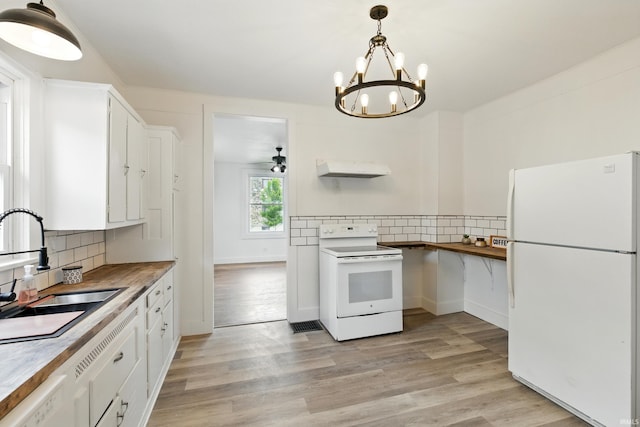 44 E Taylor St, Huntington, IN 46750 - kitchen featuring white appliances, a sink, decorative backsplash, and white cabinets