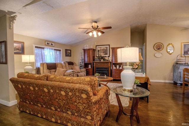 4555 E 250 S, Knox, IN 46534 - living area with ceiling fan, baseboards, dark wood-style flooring, vaulted ceiling, and a fireplace