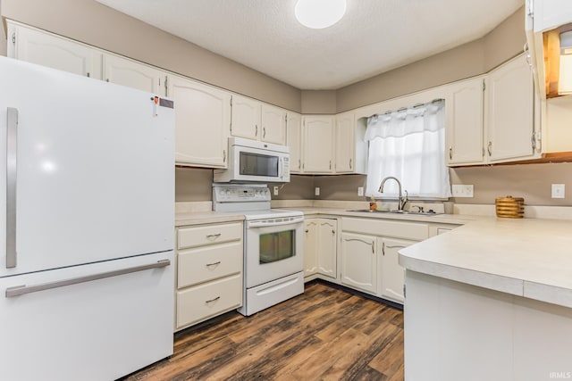 3608 W 31st St, Muncie, IN 47302 - kitchen with white appliances, a sink, dark wood-type flooring, white cabinetry, and a textured ceiling