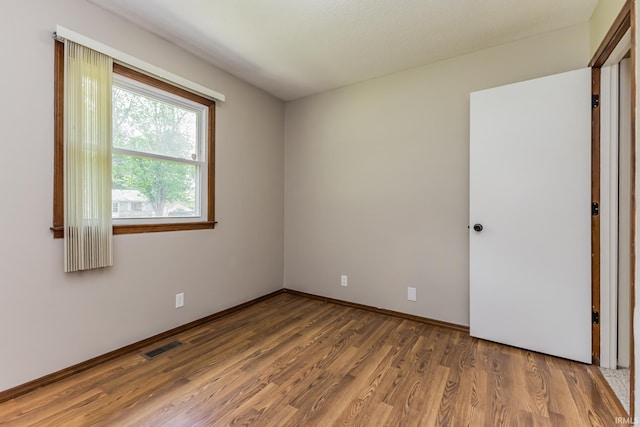 3608 W 31st St, Muncie, IN 47302 - empty room featuring wood finished floors and baseboards