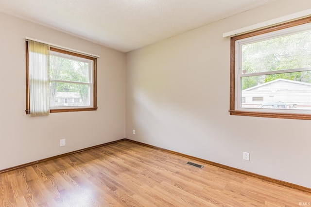 3608 W 31st St, Muncie, IN 47302 - empty room with light wood finished floors and baseboards