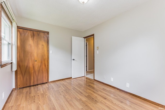 3608 W 31st St, Muncie, IN 47302 - unfurnished bedroom featuring light wood-style floors and baseboards
