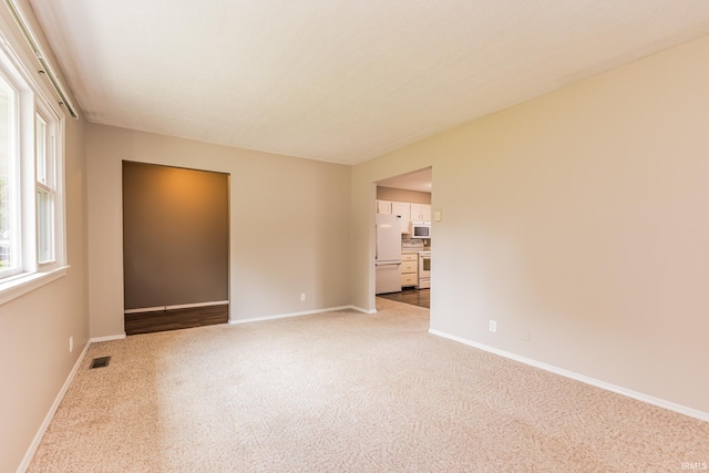 3608 W 31st St, Muncie, IN 47302 - carpeted spare room featuring baseboards