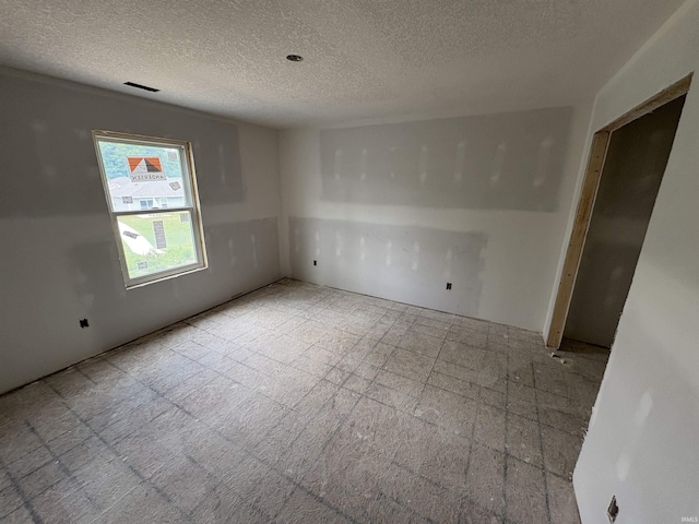 4792 Falcon Pkwy, New Haven, IN 46774 - spare room with a textured ceiling