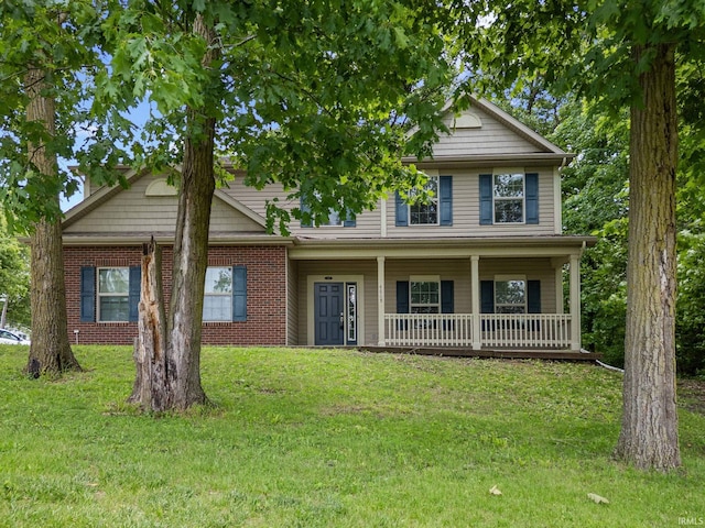 4665 S 150 E, Lafayette, IN 47909 - view of front of property with a porch, a front yard, and brick siding