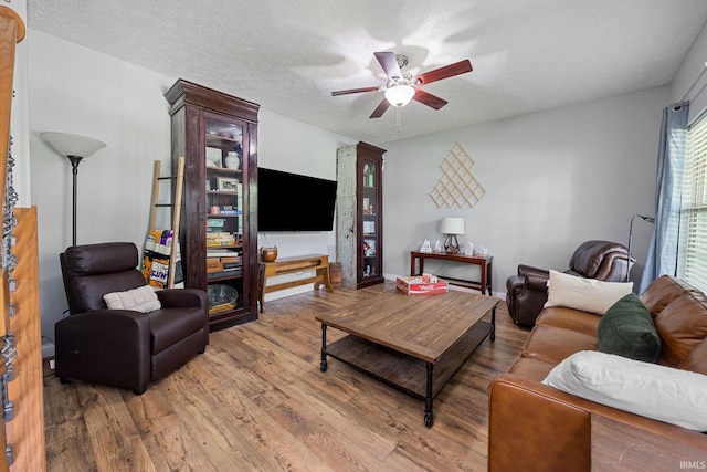 4665 S 150 E, Lafayette, IN 47909 - living room featuring ceiling fan, wood finished floors, and a textured ceiling
