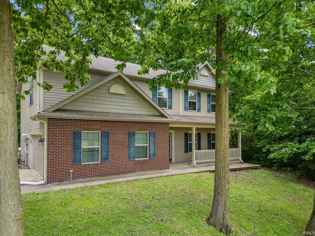 4665 S 150 E, Lafayette, IN 47909 - view of front of property with a porch, a front lawn, a shingled roof, and brick siding