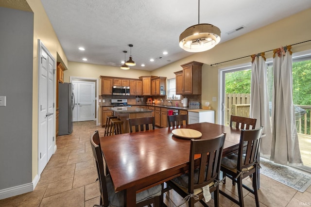 4665 S 150 E, Lafayette, IN 47909 - dining room with baseboards, recessed lighting, and a textured ceiling
