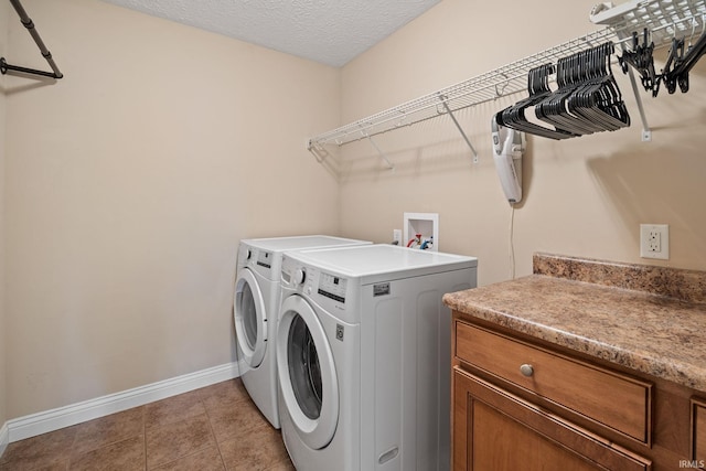 4665 S 150 E, Lafayette, IN 47909 - washroom featuring baseboards, separate washer and dryer, a textured ceiling, and light tile patterned floors