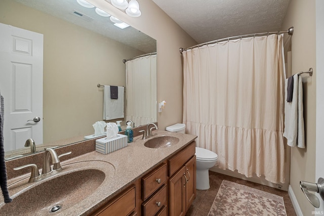 4665 S 150 E, Lafayette, IN 47909 - full bath with toilet, double vanity, tile patterned floors, a textured ceiling, and a shower with shower curtain