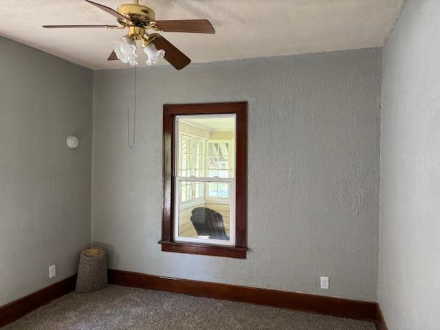 1515 E Donald St, South Bend, IN 46613 - carpeted spare room with baseboards and ceiling fan