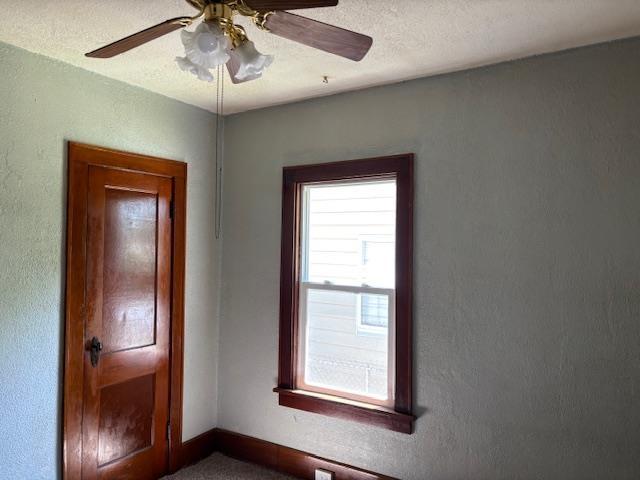 1515 E Donald St, South Bend, IN 46613 - empty room featuring a ceiling fan and baseboards