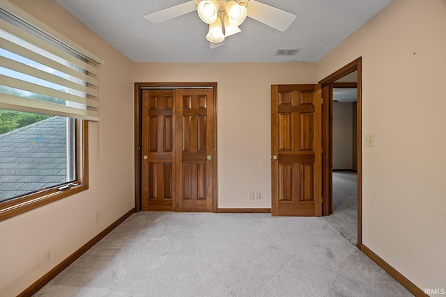 56 Jester Ct, Lafayette, IN 47905 - unfurnished bedroom with light carpet, baseboards, a closet, and ceiling fan