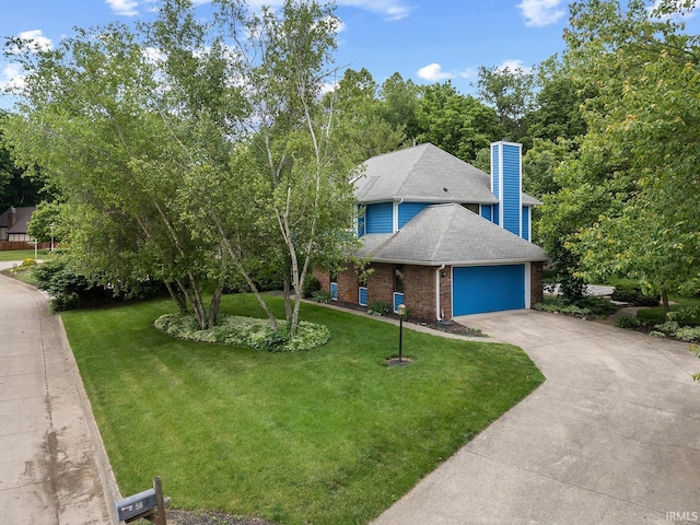 56 Jester Ct, Lafayette, IN 47905 - view of front of home with a garage, brick siding, concrete driveway, roof with shingles, and a front yard