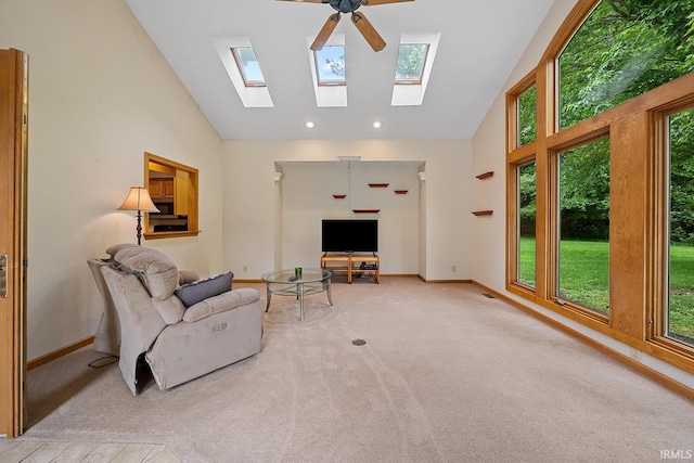 56 Jester Ct, Lafayette, IN 47905 - living room featuring a ceiling fan, high vaulted ceiling, baseboards, a skylight, and carpet