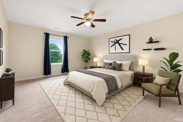 496 Arbor Ln, Huntington, IN 46750 - bedroom with light carpet, baseboards, and a ceiling fan