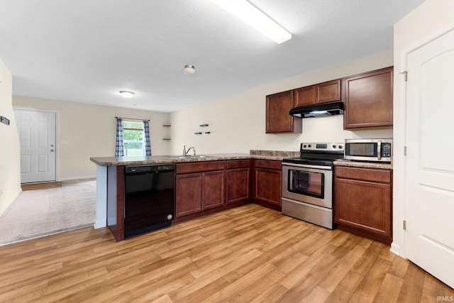 496 Arbor Ln, Huntington, IN 46750 - kitchen featuring appliances with stainless steel finishes, under cabinet range hood, a peninsula, light wood finished floors, and a sink