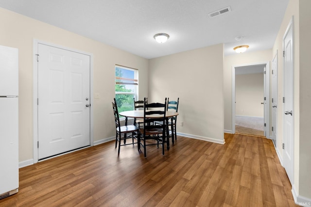 496 Arbor Ln, Huntington, IN 46750 - dining area with light wood-style floors and baseboards