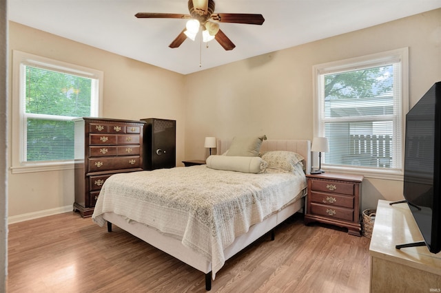 2012 Clayton Ave, Evansville, IN 47715 - bedroom featuring light wood-type flooring, a ceiling fan, and baseboards