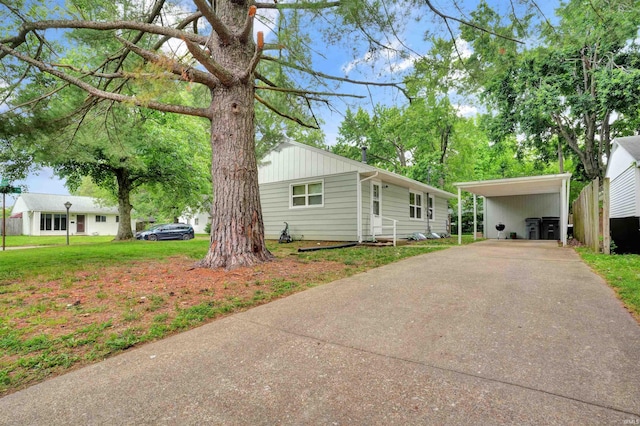 2012 Clayton Ave, Evansville, IN 47715 - view of front of property featuring driveway, a carport, and a front yard