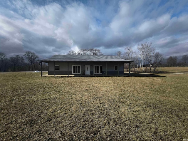 1230 S Iron Mountain Rd, Bloomfield, IN 47424 - view of front facade featuring a front yard and metal roof