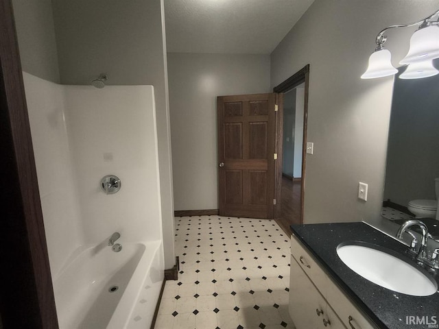 1230 S Iron Mountain Rd, Bloomfield, IN 47424 - bathroom with tile patterned floors, vanity, toilet, baseboards, and tub / shower combination