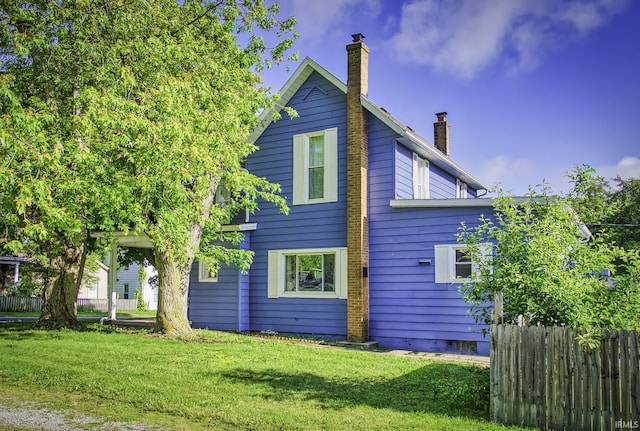 11871 N Wayne St, Zanesville, IN 46799 - rear view of property featuring a chimney