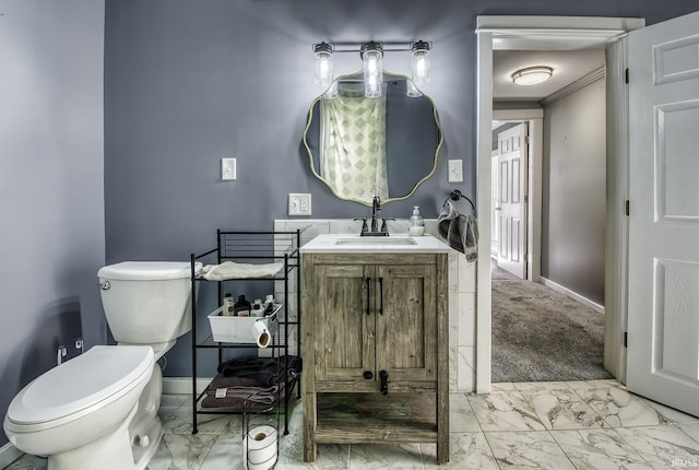11871 N Wayne St, Zanesville, IN 46799 - bathroom with marble look tiles, toilet, vanity, and baseboards