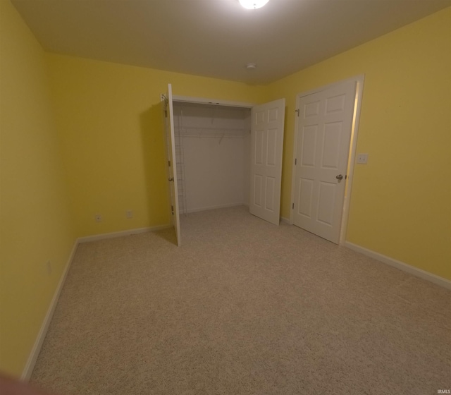 3408 Fox Ct, Evansville, IN 47711 - unfurnished bedroom with light colored carpet, baseboards, and a closet