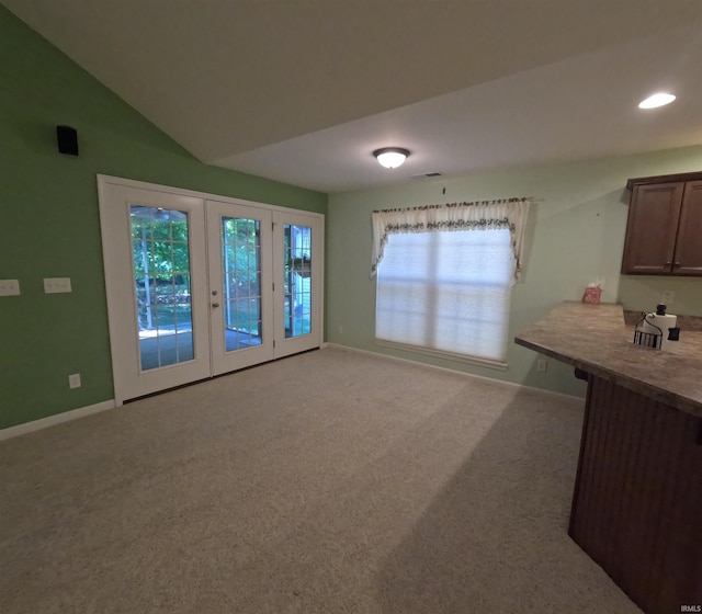 3408 Fox Ct, Evansville, IN 47711 - unfurnished dining area with carpet flooring, baseboards, french doors, recessed lighting, and vaulted ceiling