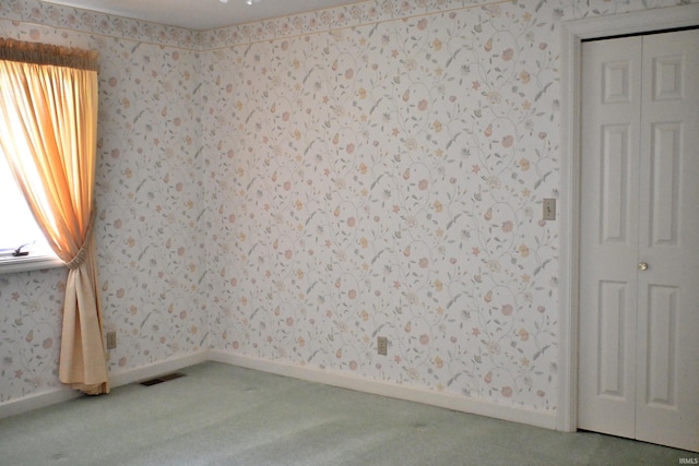 1029 S University Dr, Jasper, IN 47546 - carpeted empty room with wallpapered walls and baseboards